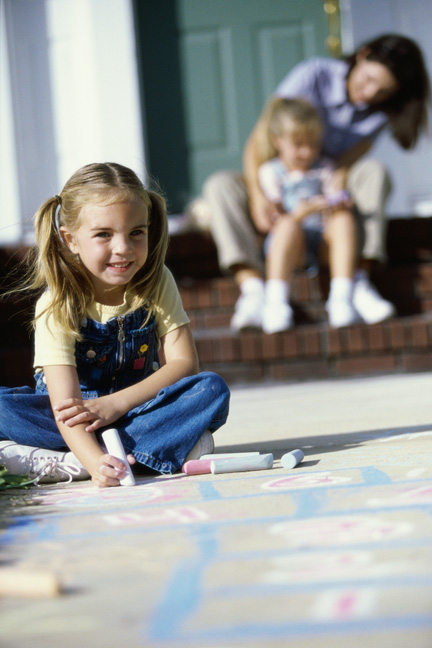 Daughter playing with chalk