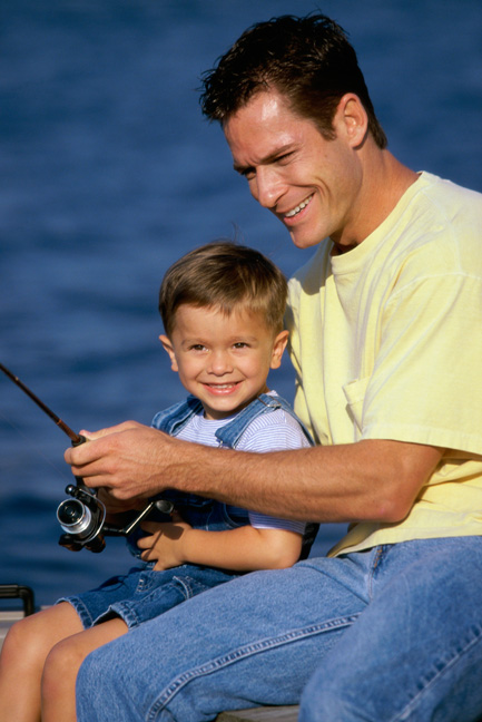 Father teaching son to fish.