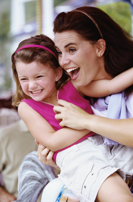 Smiling mother and young daughter