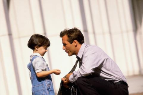 Dad speaking to child outside courthouse