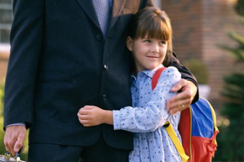 Daughter hugging dad before going off to school