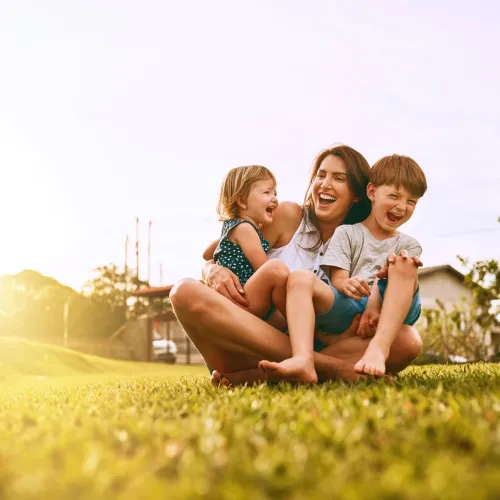 Mom with her kids outside. 