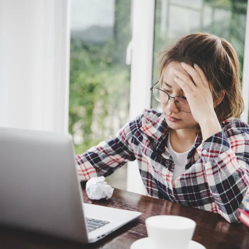 Serious woman on laptop. 