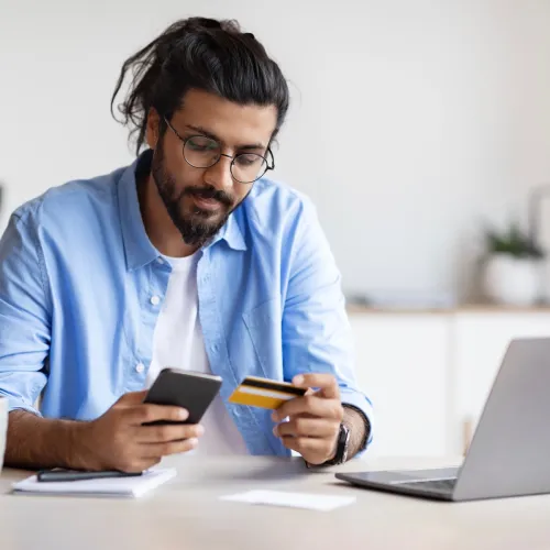 Man online shopping on laptop. 