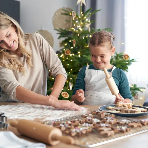 Mom and daughter making cookies. 