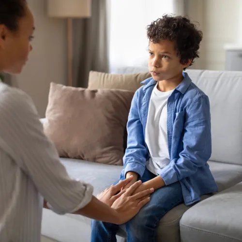 Mom and young son having a serious discussion.