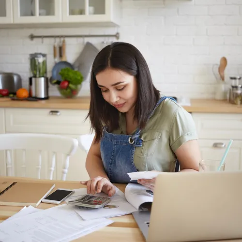 Woman on laptop doing taxes.
