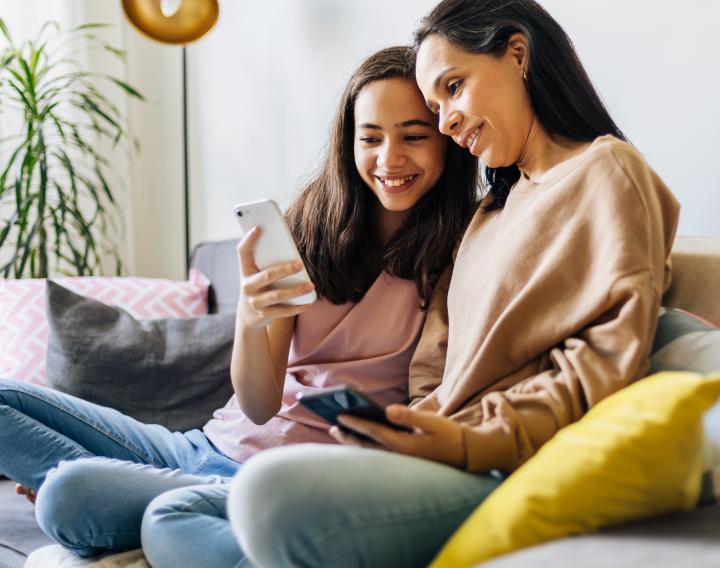 A mother and daughter take a video call together