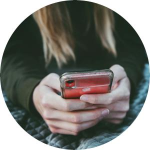 Woman's hands holding a smartphone.