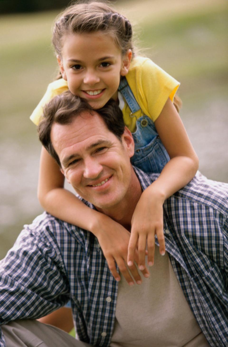 Father and daughter smiling