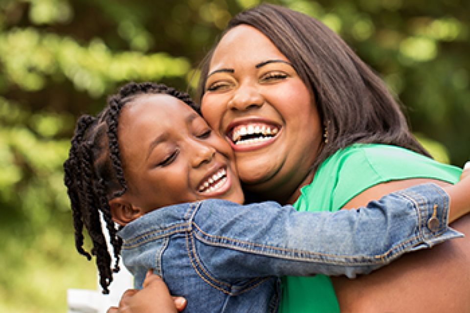 mom and child smiling