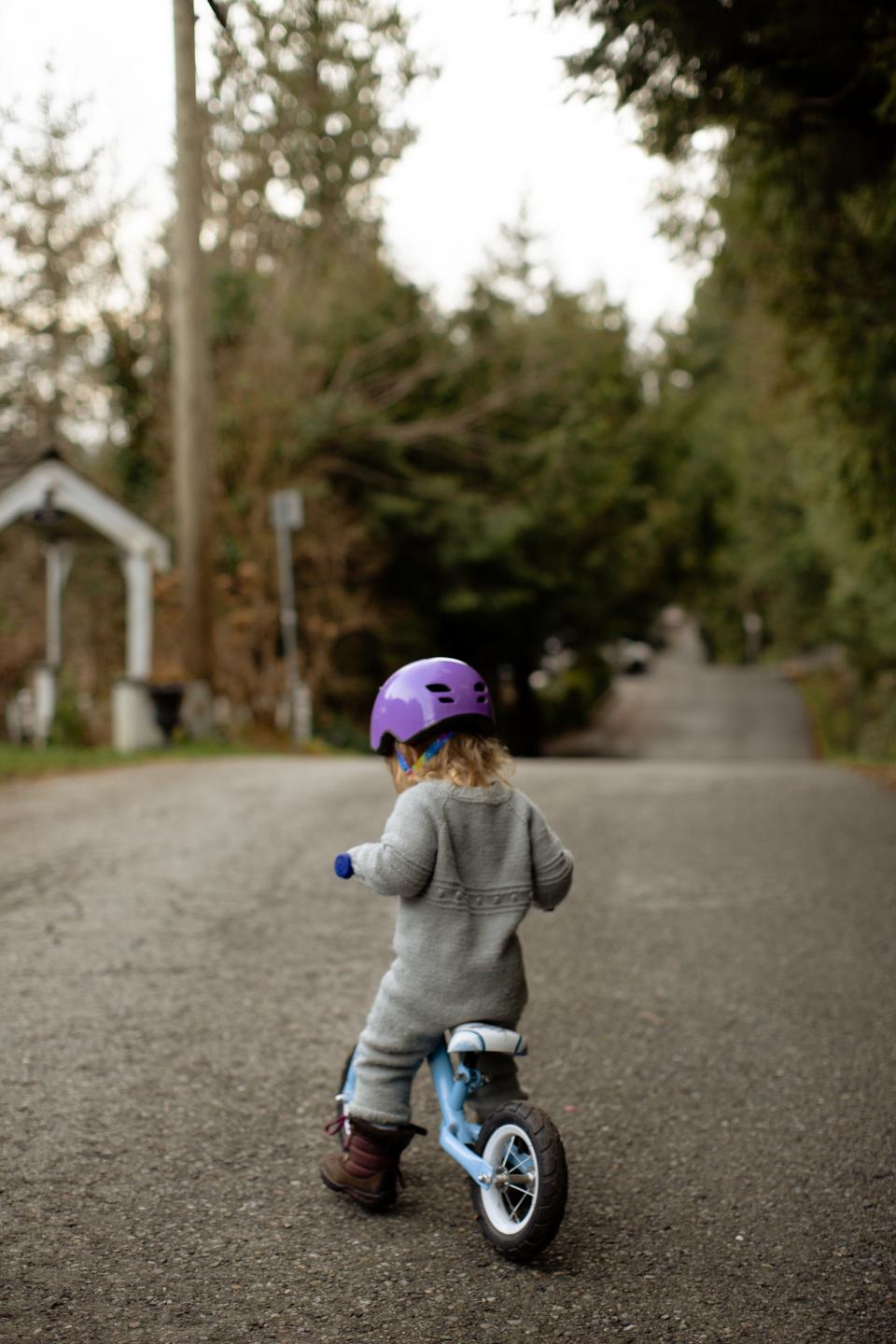 Child on bicycle with helmet