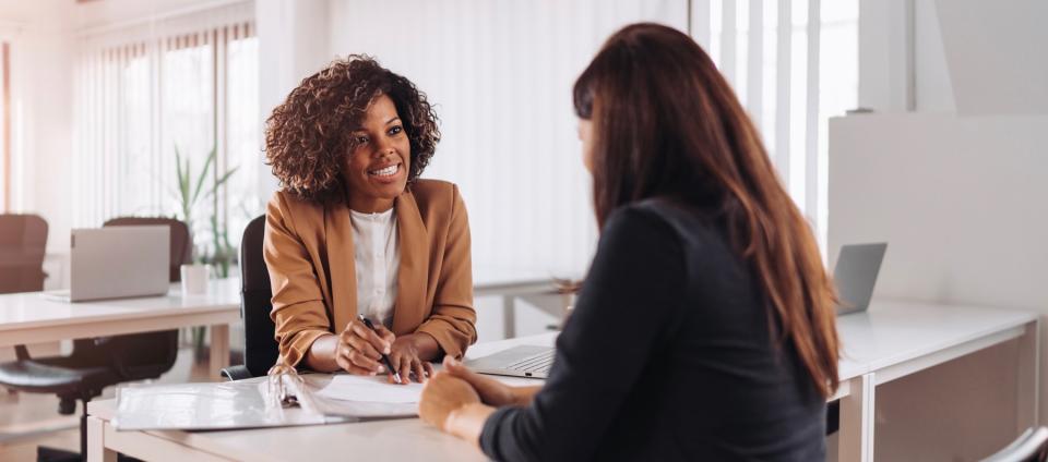Woman consulting with a female business professional