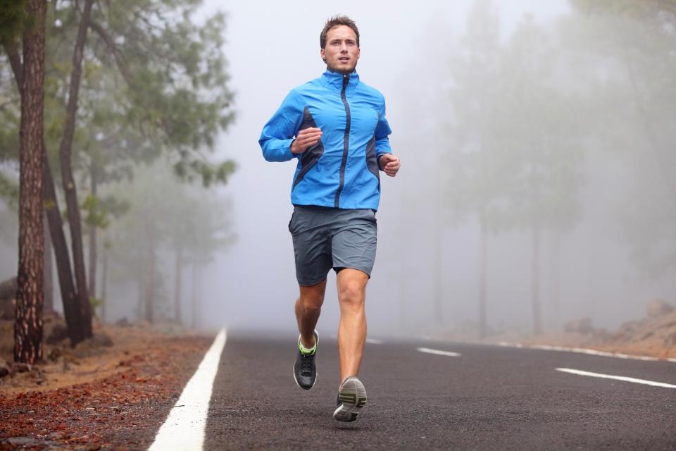 Man running on road. 