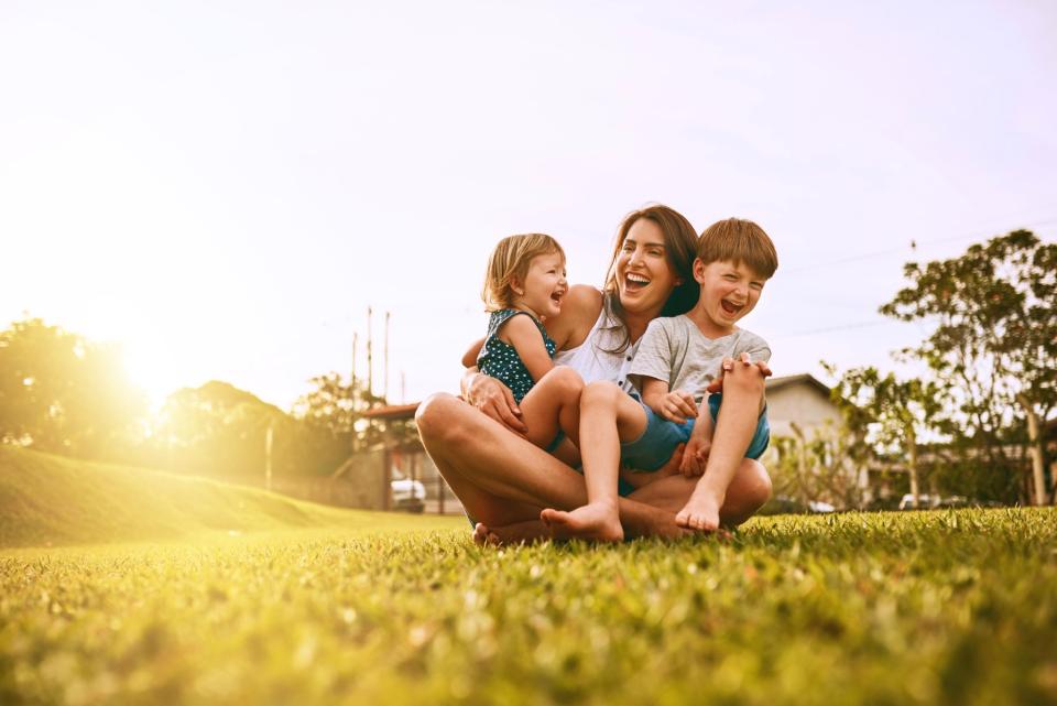 Mom with her kids outside. 