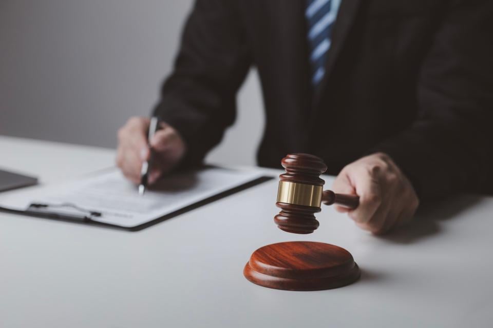 Judge with gavel.