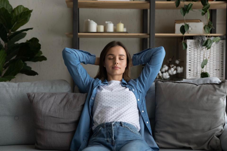 Woman relaxing on couch.