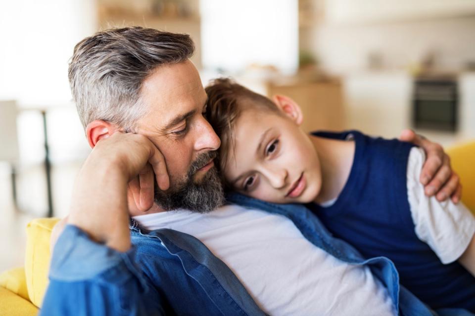 Dad comforting son. 