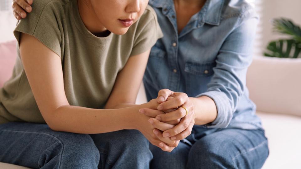 Parent and child hold hands