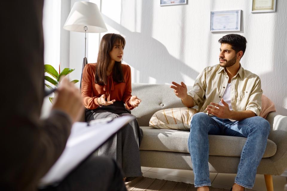 Man and woman meeting with professional. 