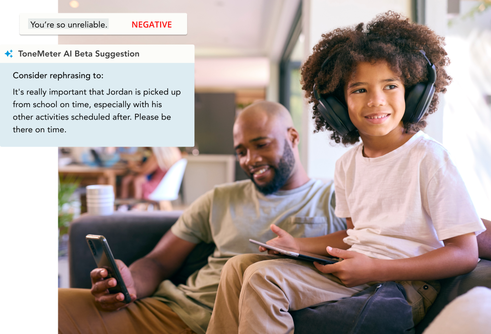 A father sits on the couch next to his daughter while looking at his phone. Next to him is an example of ToneMeter AI Beta in the OurFamilyWizard app.