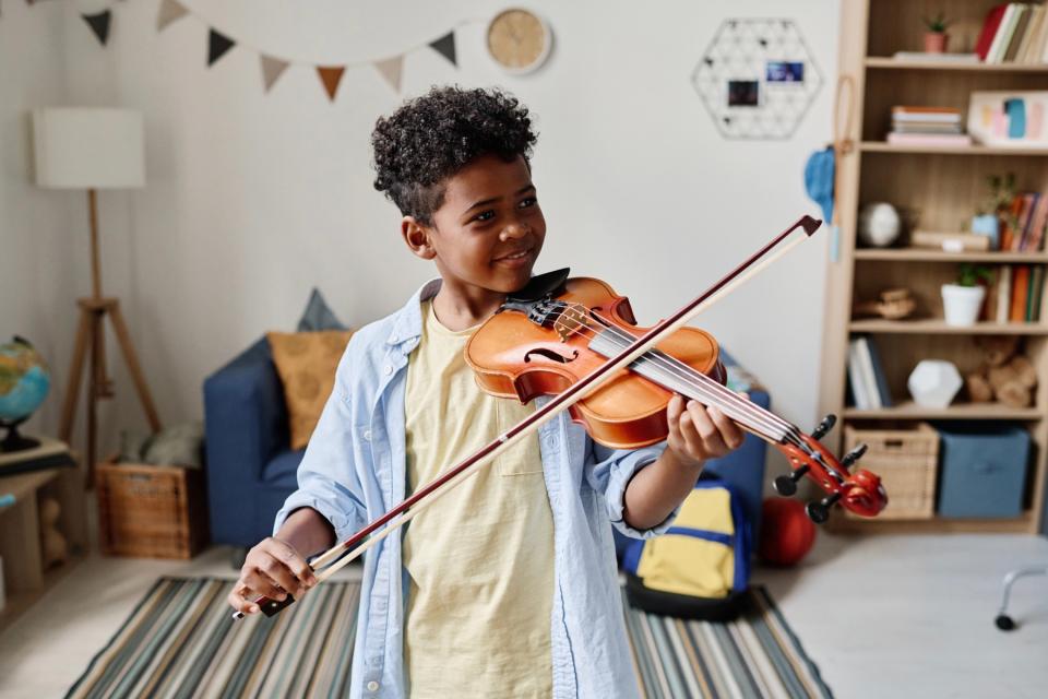 Boy playing violin.