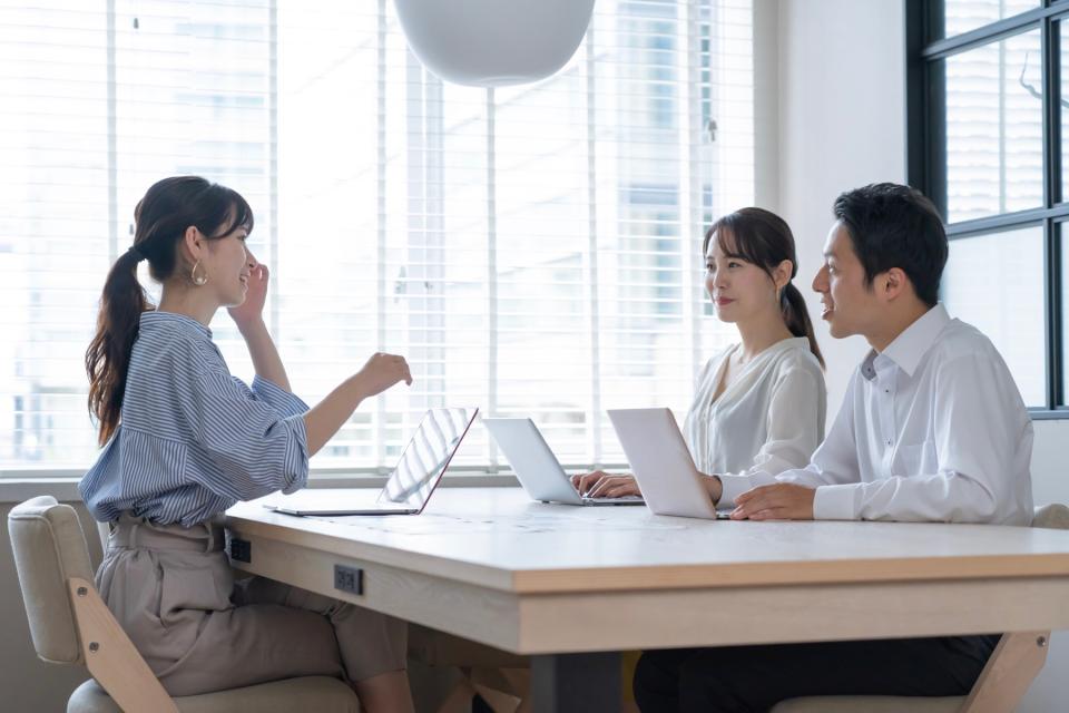 Man and woman meeting with an attorney.