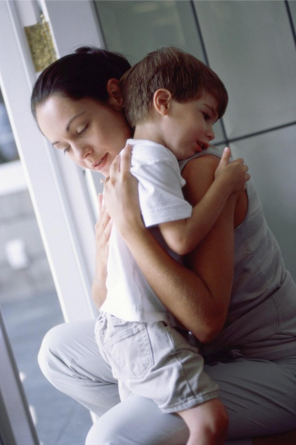 Mom and son hugging